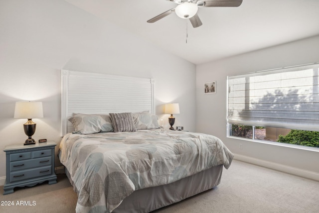 bedroom with lofted ceiling, light colored carpet, and ceiling fan