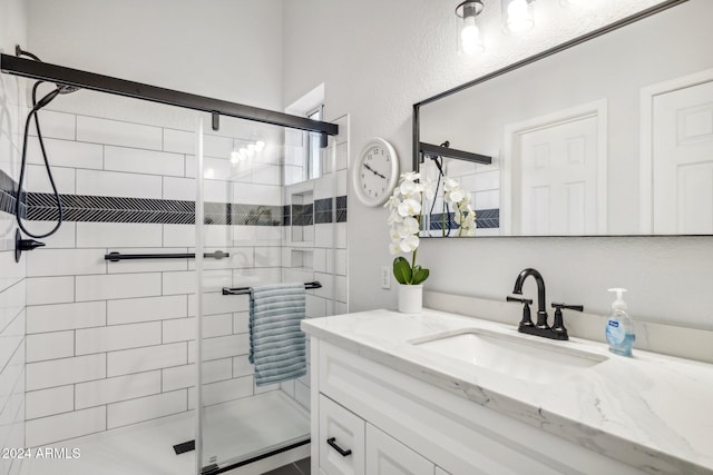 bathroom with vanity and an enclosed shower