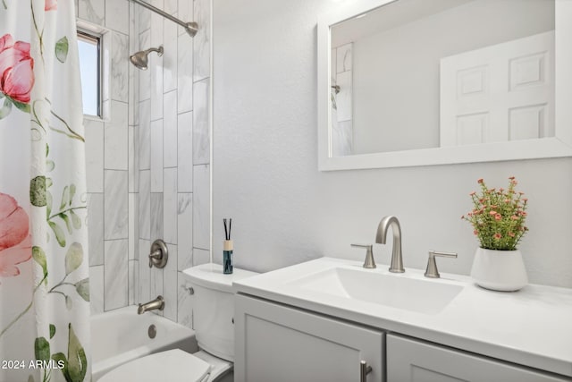 full bathroom with shower / bath combo, vanity, and toilet