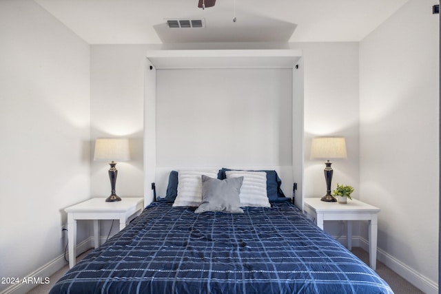 bedroom featuring dark colored carpet and ceiling fan