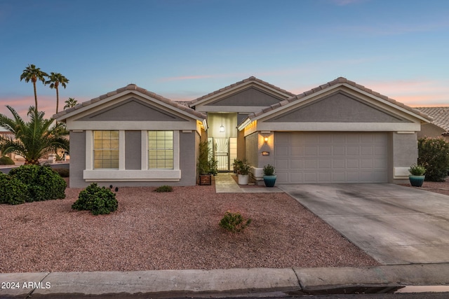 ranch-style house featuring a garage