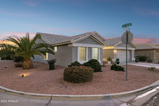 ranch-style house featuring a garage