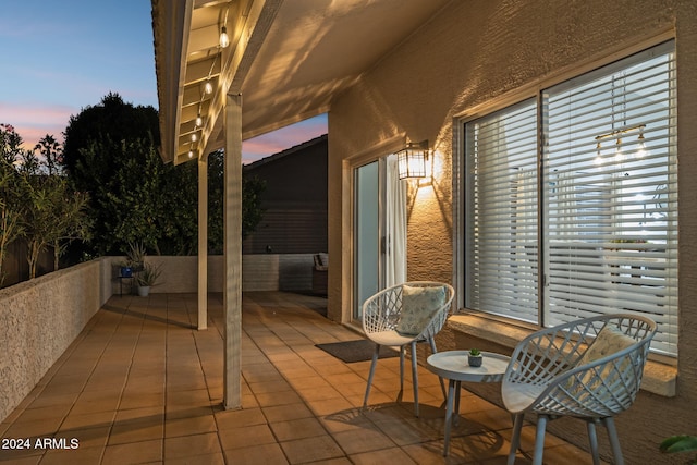 view of patio terrace at dusk