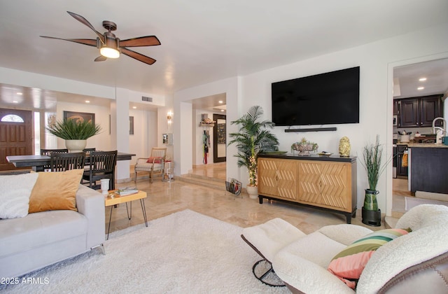 living room with ceiling fan