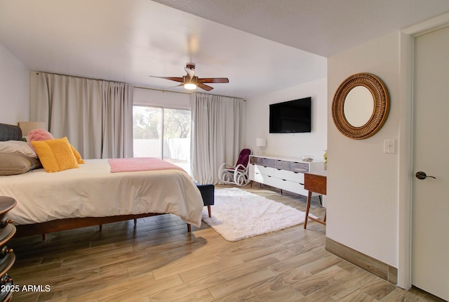 bedroom featuring ceiling fan and light hardwood / wood-style flooring