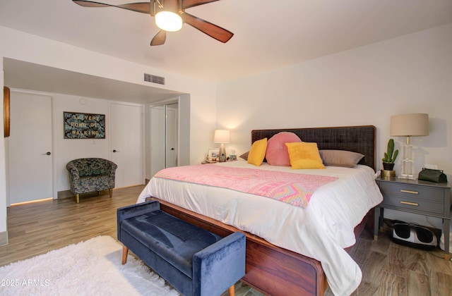 bedroom featuring hardwood / wood-style flooring and ceiling fan