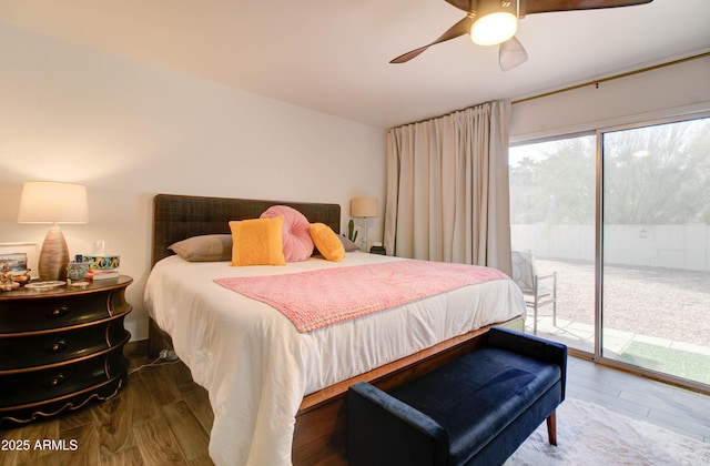 bedroom featuring ceiling fan, access to exterior, and hardwood / wood-style floors