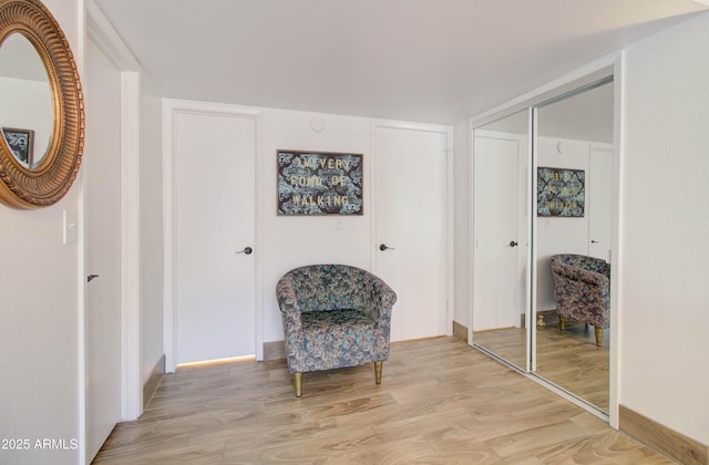 sitting room with light wood-type flooring