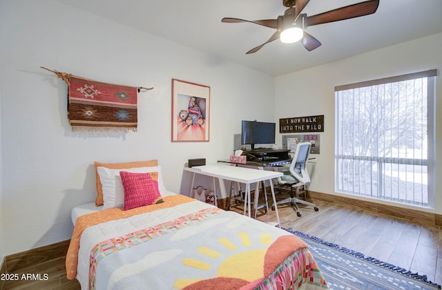 bedroom featuring ceiling fan and wood-type flooring