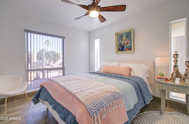 bedroom featuring dark hardwood / wood-style floors and ceiling fan