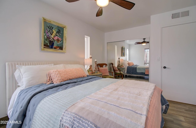 bedroom with ceiling fan, hardwood / wood-style floors, and a closet