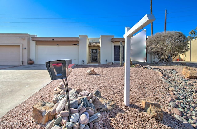 southwest-style home featuring a garage