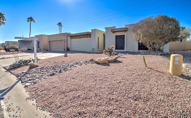 southwest-style home with a garage