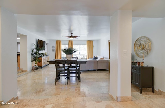 dining space featuring ceiling fan