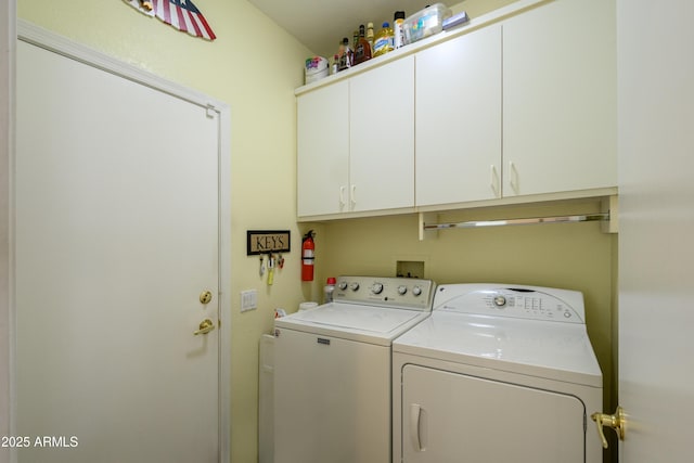 laundry room with cabinets and independent washer and dryer