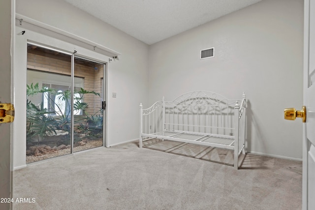 unfurnished bedroom with light colored carpet