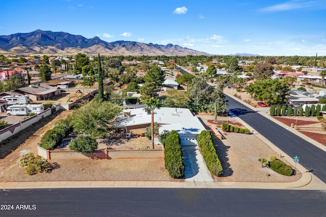 birds eye view of property with a mountain view