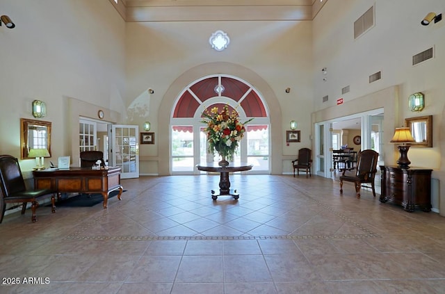 tiled foyer entrance with french doors