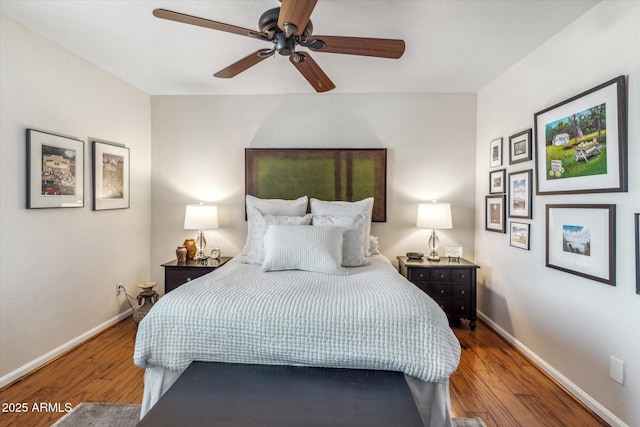 bedroom featuring hardwood / wood-style flooring and ceiling fan