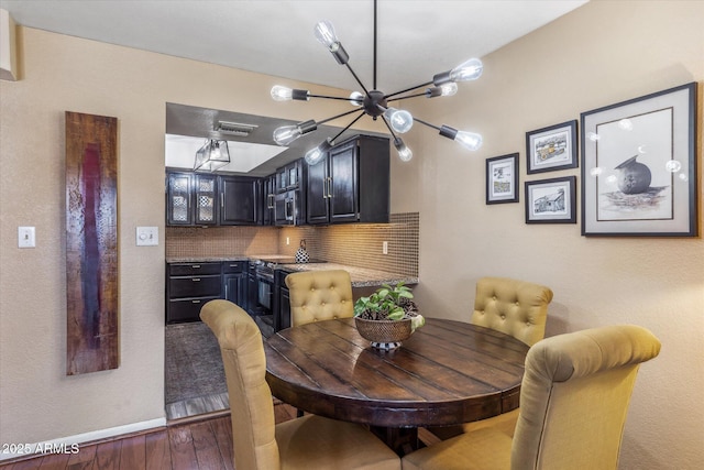 dining area with dark hardwood / wood-style floors