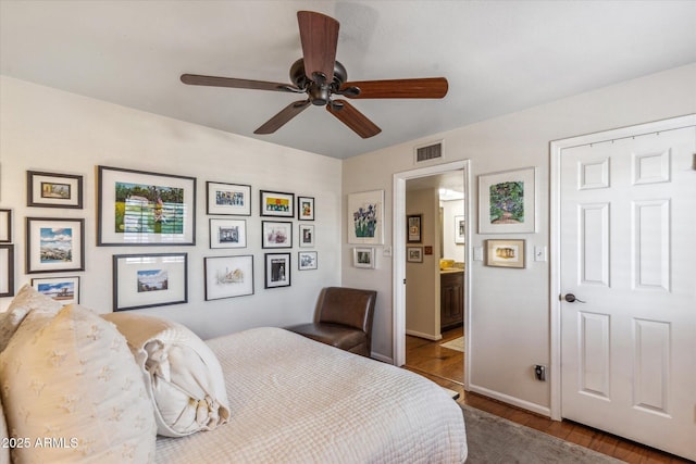 bedroom with wood-type flooring and ceiling fan