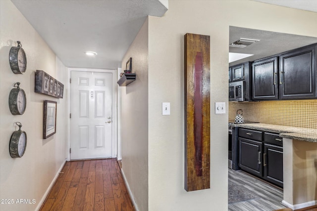 corridor featuring dark wood-type flooring