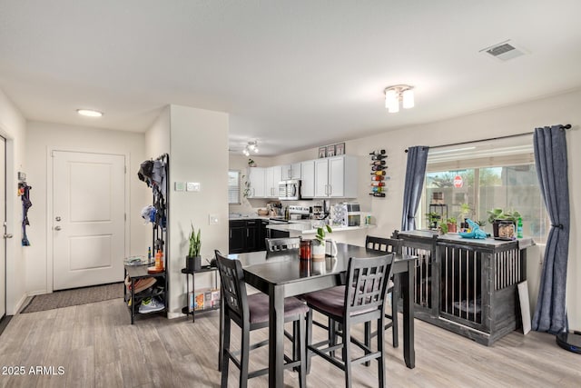 dining area featuring light hardwood / wood-style floors