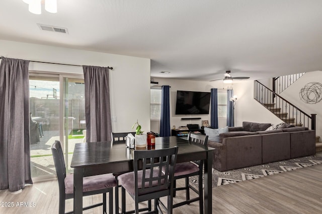 dining area featuring ceiling fan and light hardwood / wood-style floors