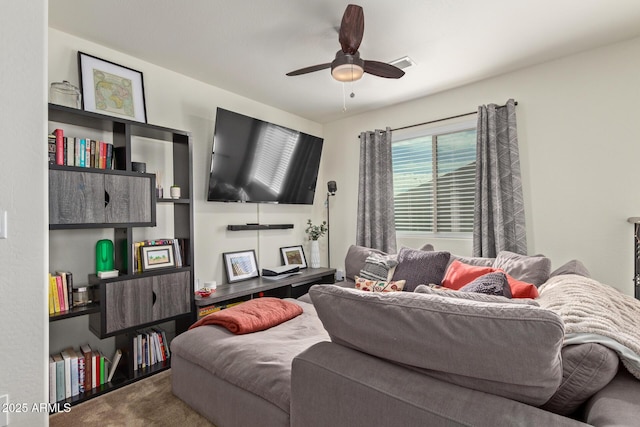 living room featuring carpet flooring and ceiling fan