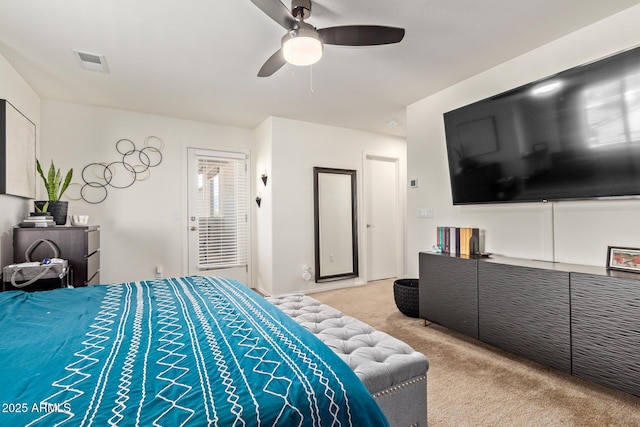 bedroom with light colored carpet and ceiling fan