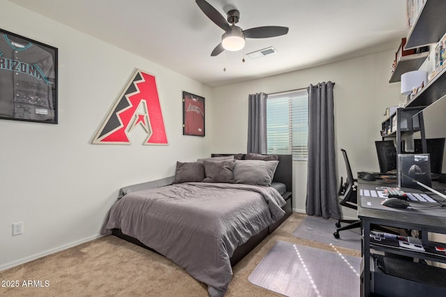 bedroom featuring ceiling fan and carpet