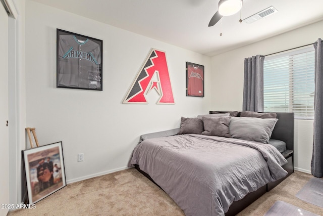 bedroom featuring light carpet and ceiling fan