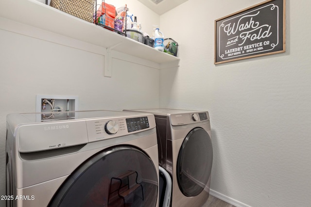 washroom featuring separate washer and dryer