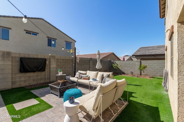 view of patio featuring an outdoor living space with a fire pit