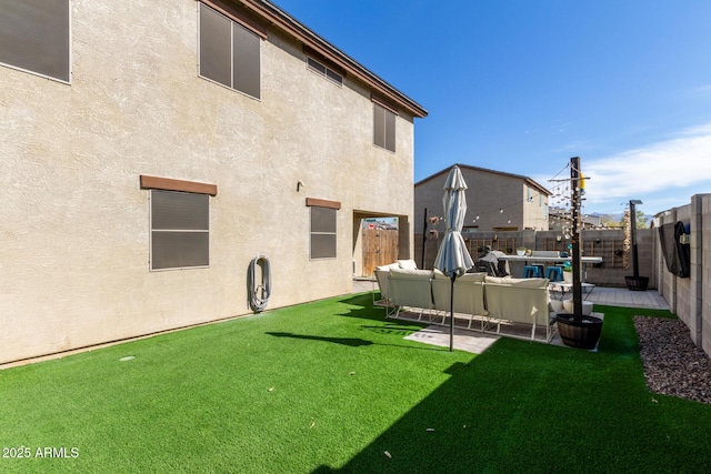 rear view of house featuring a lawn