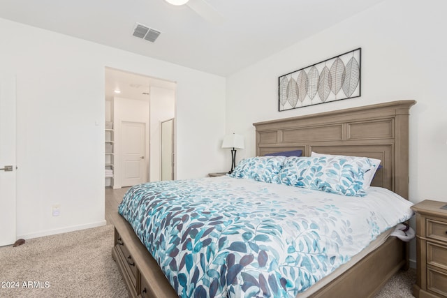 bedroom featuring light carpet and ceiling fan