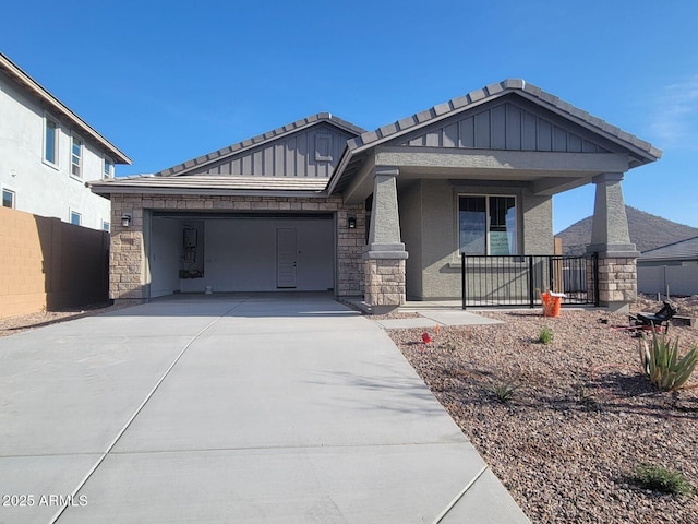 view of front of home featuring covered porch and a garage