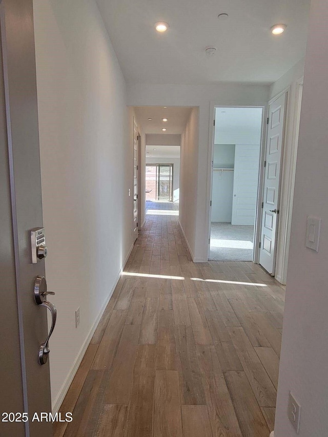 corridor featuring light hardwood / wood-style flooring