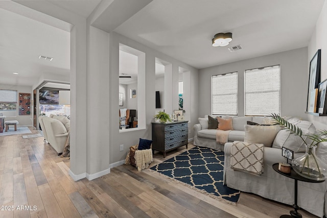 living area with hardwood / wood-style floors