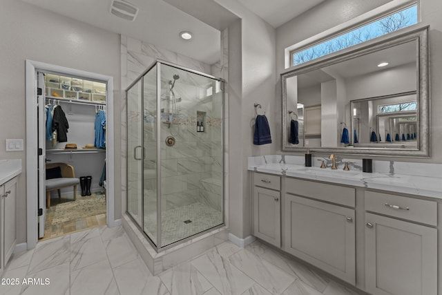 bathroom with vanity and walk in shower