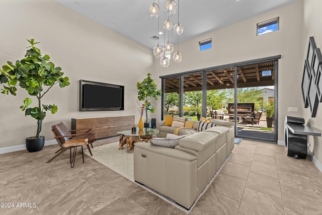 living room featuring a notable chandelier