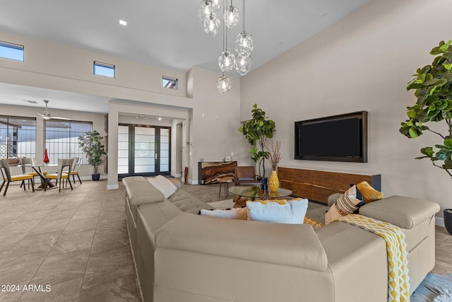 living room with tile patterned floors and ceiling fan