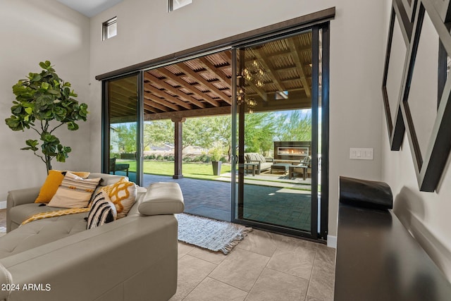 doorway to outside with light tile patterned flooring