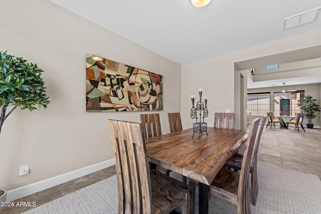 dining space with tile patterned flooring