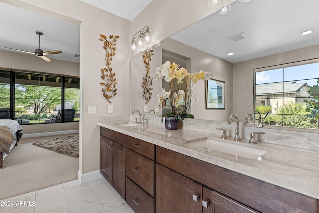 bathroom with ceiling fan and vanity