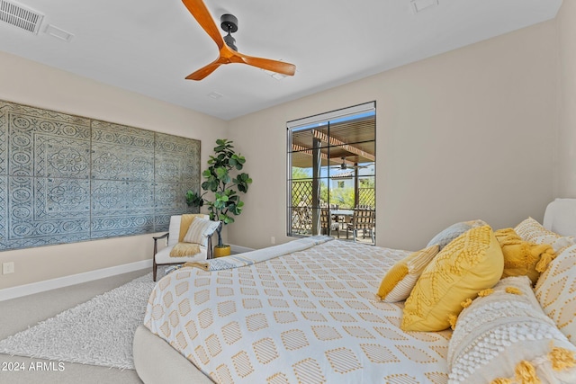 carpeted bedroom with access to exterior and ceiling fan