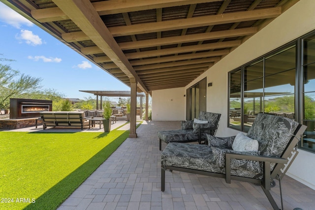 view of patio / terrace featuring an outdoor living space with a fireplace