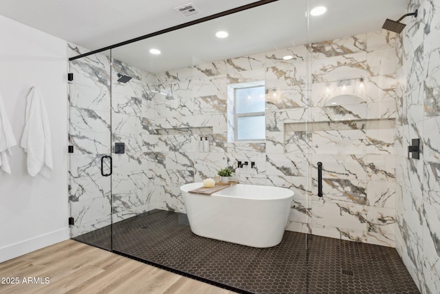 4842 E Surrey Ave, Scottsdale, AZ 85254 - bathroom featuring a soaking tub, a marble finish shower, wood finished floors, and recessed lighting