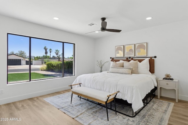 4842 E Surrey Ave, Scottsdale, AZ 85254 - bedroom with light wood-type flooring, recessed lighting, and a ceiling fan