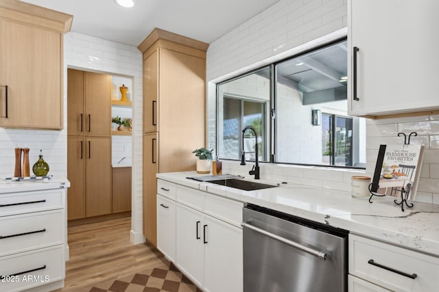 4842 E Surrey Ave, Scottsdale, AZ 85254 - kitchen featuring stainless steel dishwasher, decorative backsplash, light wood finished floors, light stone countertops, and light brown cabinetry